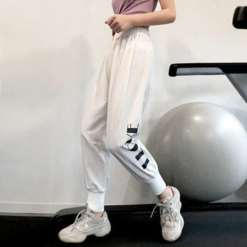 Pantaloni da tuta sportivi con scritte laterali - bianco / s