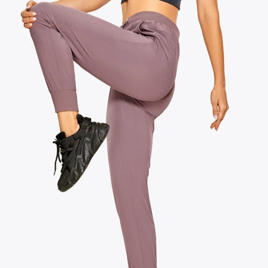 Pantaloni della tuta sportivi con polsini - beige / xs