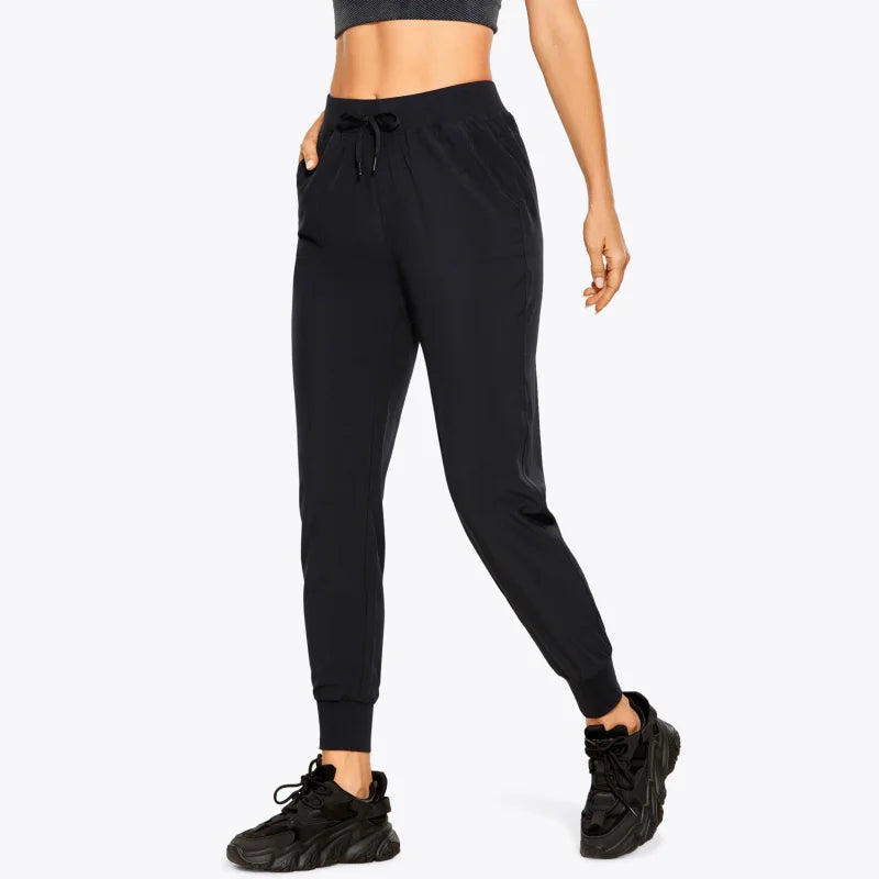 Pantaloni della tuta sportivi con polsini - nero / xs