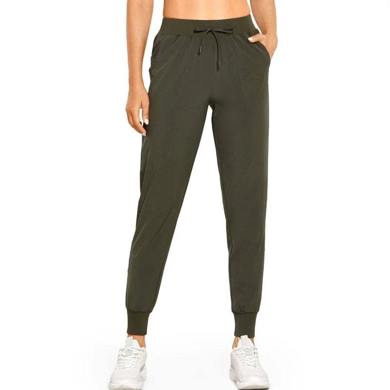 Pantaloni della tuta sportivi con polsini - verde / xs